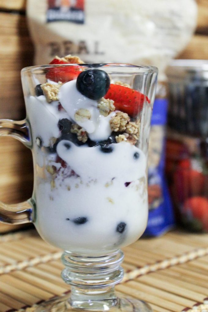 Parfaits are one of my favorite ways to enjoy summer berries. They work as both a healthier dessert option or as a tasty alternative to plain cereal for breakfast. The best parfaits include yogurt, strawberries, blueberries and granola. Check out this very berry strawberry blueberry yogurt parfait made with GreatGrains Blueberry Pecan Granola!