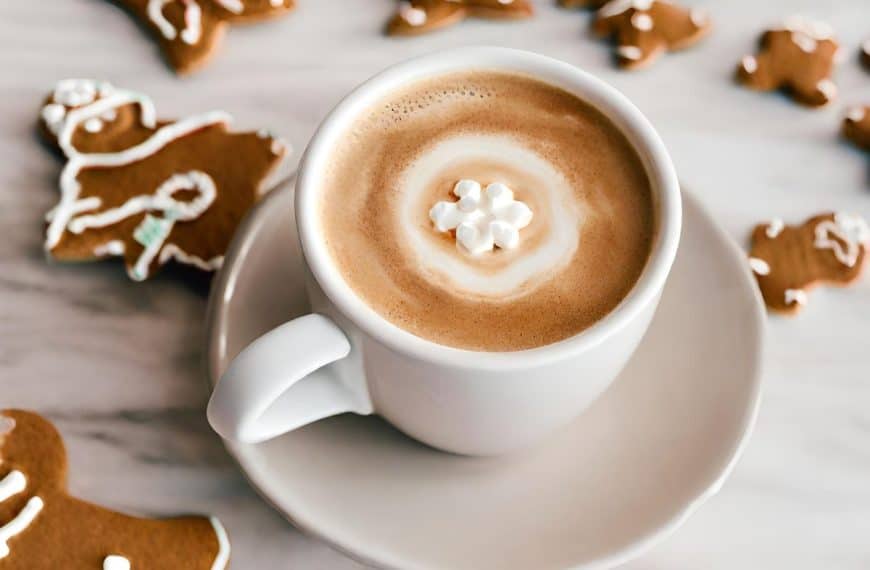Sip holiday joy with my Perfect Gingerbread Latte recipe! Aromatic espresso, steamed gingerbread-infused milk, topped with whipped cream and spice. SO good!